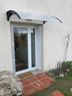 awning over a door of a house at Charmant studio avec vue sur le château de Montségur in Montferrier