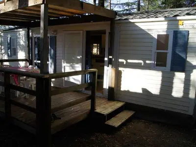 a front porch of a tiny house with a staircase at Mobil-home avec Terrasse pour 4 pers. - API-1-52-1601 in Sournia