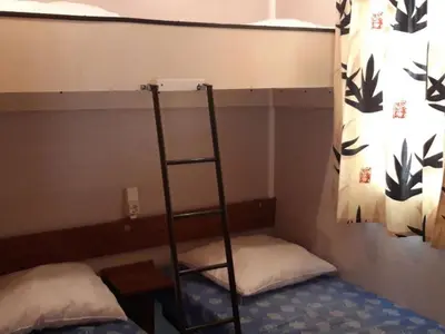 a bunk bed with a ladder in a room at Mobil-Home avec Terrasse pour 4 pers. - API-1-52-1600 in Sournia