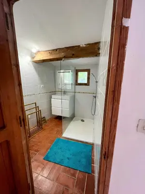 a bathroom with a shower and a blue rug at Mediterranean Haven In Pine Forest At Leucate in Roquefort-des-Corbières