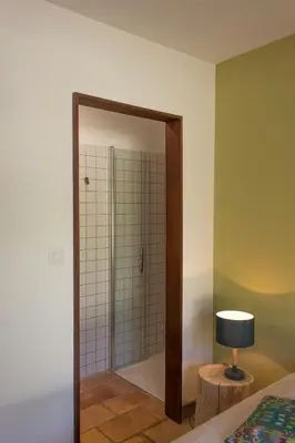 a bathroom with a shower with a glass door at Accessible Villa In The Heart Of Corbières in Marcorignan