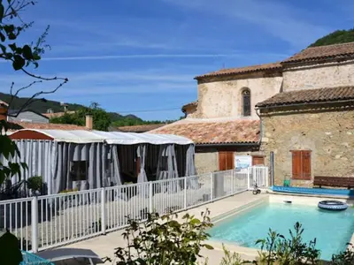a house with a swimming pool next to a building at Chalet PMR avec Terrasse pour 4 Pers, Roquefeuil - API-1-52-139 in Roquefeuil