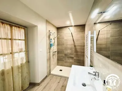 a bathroom with a sink and a shower at Laguzou in Saint-Julien-de-Briola