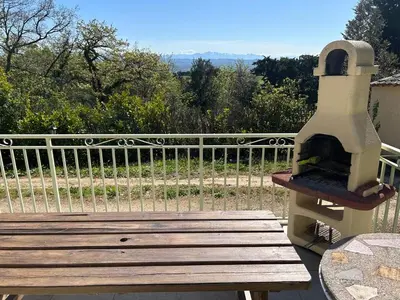a pizza oven sitting on top of a wooden bench at Nature stay, French Villa in Villarzel-du-Razès