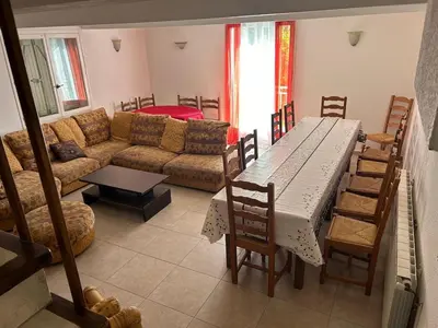 a living room with a table and a couch at Nature stay, French Villa in Villarzel-du-Razès