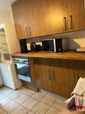 a kitchen with a counter with a microwave and a refrigerator at Nature stay, French Villa in Villarzel-du-Razès