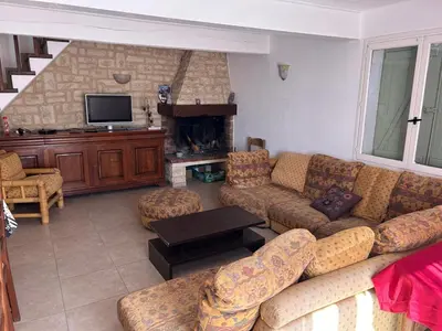 a living room with a couch and a fireplace at Nature stay, French Villa in Villarzel-du-Razès