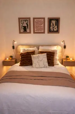 a bedroom with a large bed with three pictures on the wall at Peaceful & Elegant Retreat in the heart of town in Carcassonne