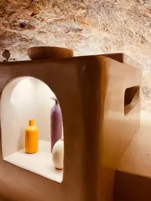 a bathroom with a white toilet in a room at Escapade Troglodyte in Fitou