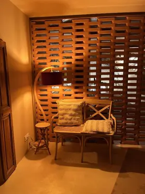 a balcony with chairs and a view of a city at Escapade Troglodyte in Fitou