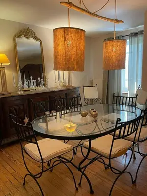 a dining room with a glass table and chairs at Old Farmhouse Surrounded By Nature In Sidobre in Burlats