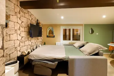 a bathroom with a shower and a sink and a mirror at Cap color-Parking public gratuit-4 guests-centre-ville in Limoux