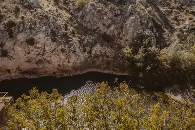 a cave in the side of a rocky mountain at Le Tamaroque in Portel-des-Corbières