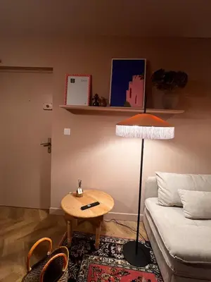 a bathroom with a sink and a toilet and a mirror at Appartement La voisine de Charles in Narbonne