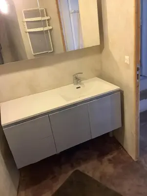 a bathroom with a sink and a mirror at La planque in Gruissan