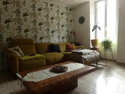 a living room with a couch and a coffee table at Mas cantecou in Mosset