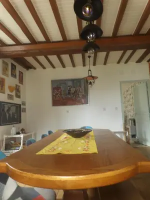 a wooden table with a bowl on top of it at Mas cantecou in Mosset