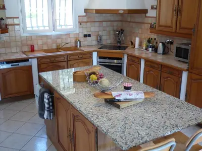 a kitchen with a granite counter top in a kitchen at Villa Lana in Verzeille