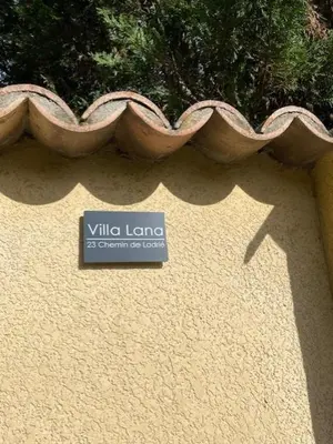 a sign on the side of a building at Villa Lana in Verzeille