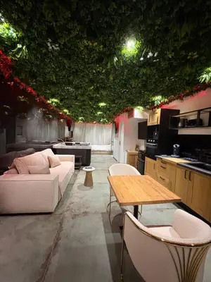 a living room with a couch and a table at Love Room végétale n102 in Narbonne