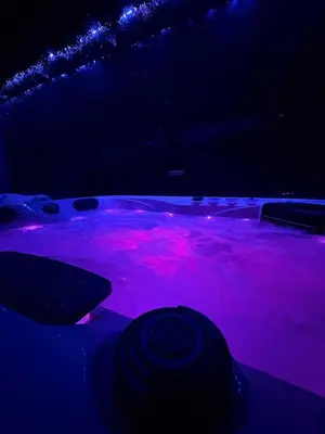 a dark room with pink lights on the floor at Love Room végétale n102 in Narbonne