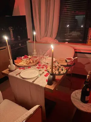 a table with two candles and food on it at Love Room végétale n102 in Narbonne
