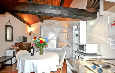a living room with a couch and a table at Maison Piscine Proche Mer in Portel-des-Corbières