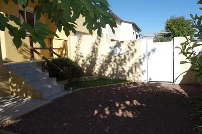 a house with a white fence and a driveway at La Cesse in Bize-Minervois