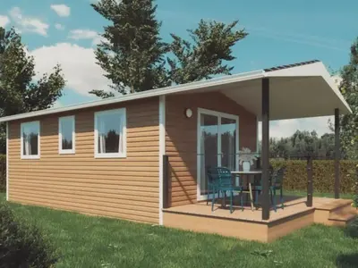 a small cabin with a deck and a table at Mobil-home à Pamiers, 4 Pers, 2 Ch, Terrasse - API-1-52-1950 in Pamiers