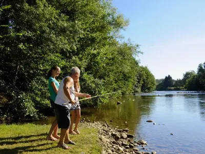 a man and two women fishing on a river at Mobil-home à Pamiers, 4 Pers, 2 Ch, Terrasse - API-1-52-1950 in Pamiers