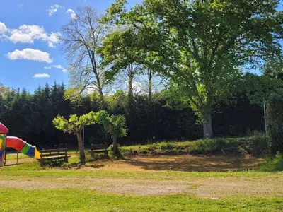 a park with a bench and a playground at Mobil-Home Confort 4 Pers. à Pamiers - API-1-52-1960 in Pamiers