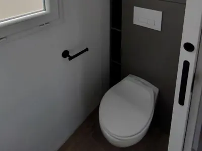 a bathroom with a white toilet in a room at Mobil-Home Confort 4 Pers. à Pamiers - API-1-52-1960 in Pamiers