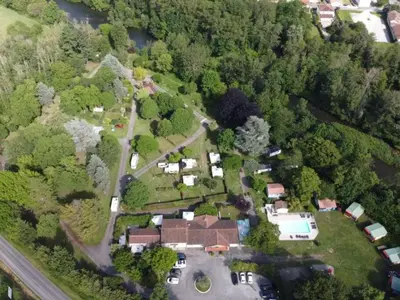 an aerial view of a house in the woods at Mobil-home cosy pour 2 à Pamiers - API-1-52-1959 in Pamiers