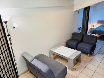 a living room with a couch and a table at Maison de village à Roquefort des Corbières in Roquefort-des-Corbières