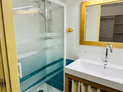 a bathroom with a sink and a shower at Maison de village à Roquefort des Corbières in Roquefort-des-Corbières