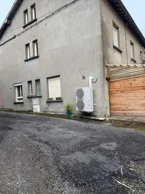 a building with a gate and a garage at Maison de village in Montferrier