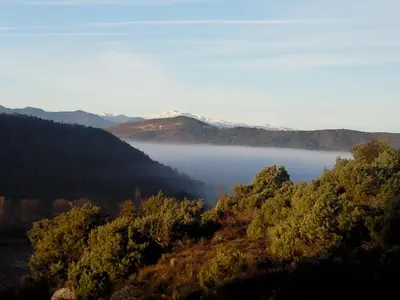 a view of a lake in the middle of a valley at Le Castillou in Luc-sur-Aude