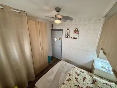 a bedroom with a bed and a ceiling fan at Appt 2 pièces 4 couchages PORT LA NOUVELLE PN730-007 in Port-la-Nouvelle