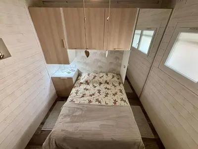 a small room with a bed and a sink at Appt 2 pièces 4 couchages PORT LA NOUVELLE PN730-007 in Port-la-Nouvelle