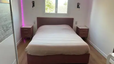 a small bedroom with a bed and a window at Maison standing 5 chambres Jardin et Garage in Aussillon