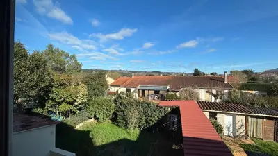 a view of a city with houses and trees at Maison standing 5 chambres Jardin et Garage in Aussillon
