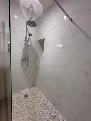 a bathroom with a shower with a glass door at Le Diamant in Narbonne