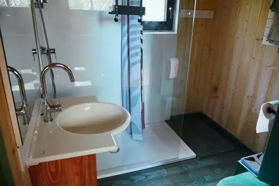 a bathroom with a sink and a shower at Les Gîtes de Montbel, nestled in nature in Montbel
