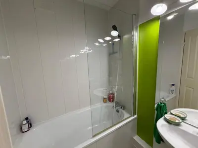 a bathroom with a glass shower and a sink at Regard du planteur d'arbres in Saint-Paul-de-Fenouillet