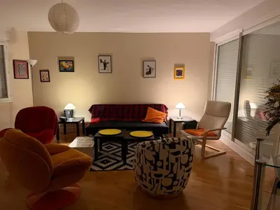 a living room with a couch and chairs at Regard du planteur d'arbres in Saint-Paul-de-Fenouillet