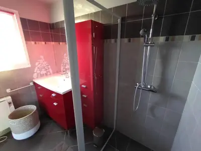 a bathroom with a red cabinet and a shower at Hacienda Del Sol, beautiful villa with pool in Sigean