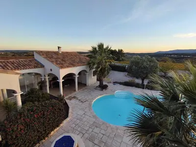 an aerial view of a house with a swimming pool at Hacienda Del Sol, beautiful villa with pool in Sigean