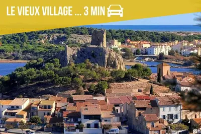 an image of a town with a castle on a hill at NOUVEAU La Grande Voile Piscine-Parking-Draps By LCG in Gruissan