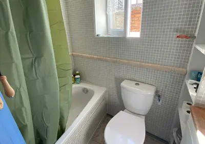 a bathroom with a toilet and a sink and a mirror at Maison & Village Quarante - French Village House in Quarante
