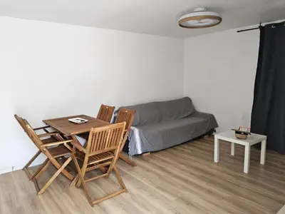 a living room with a couch and a table and chairs at Barracuda of port terrace sea for 6 in Port-la-Nouvelle